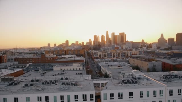 Aerial-shot-over-buildings-in-Downtown-Los-Angeles-during-sunset