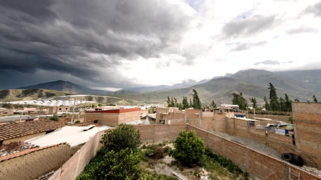 Panning-Time-Lapse-Of-Clouds-Rolling-Over-The-Small-Town-Of-Caraz-In-Peru