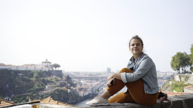 Young-woman-on-high-viewpoint-above-city