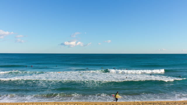 barcelona-sun-light-beach-sea-serfers-4k-time-lapse-spain