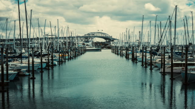 Time-Lapse-Auckland-Harbour-Bridge-Reflecting-on-Westhaven-Marina-in-Auckland