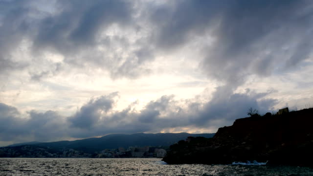 Timelapse-clouds-sea-mountain-town
