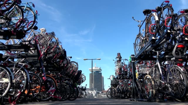 Bicycle-parking-space-in-the-city-of-Amsterdam,-a-cyclist-friendly-city,-4K