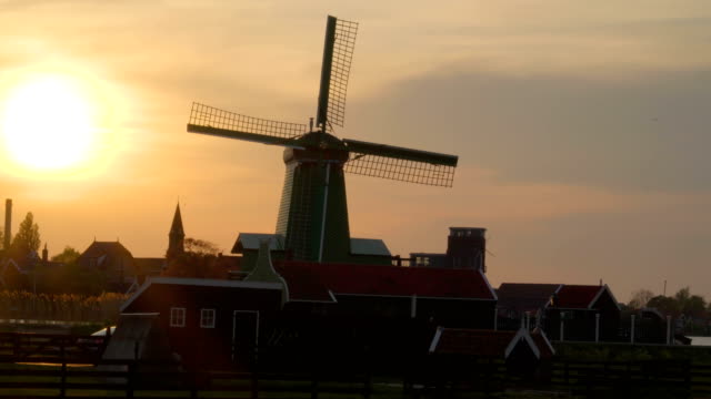 View-of-the-bright-sun-about-to-set-in-the-village-of-Zaanse-Schans