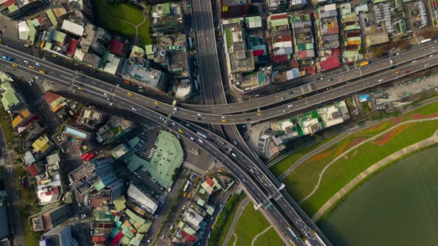 sunny-day-taipei-river-traffic-road-junction-bridge-aerial-down-view-4k-timelapse-taiwan