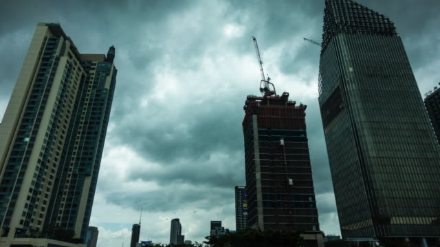 High-rise-building-in-Bangkok-with-rain-clouds-sky.