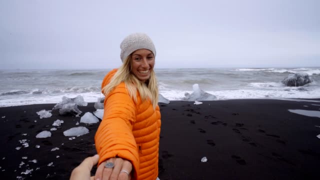 Follow-me-to-concept--girl-leading-boyfriend-to-Diamond's-beach-in-Iceland