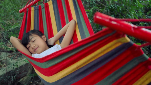 Slow-motion,-Little-girl-is-sleeping-in-hammock