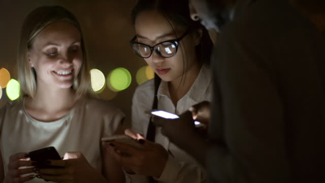 Friends-Using-Smartphones-Late-at-Night