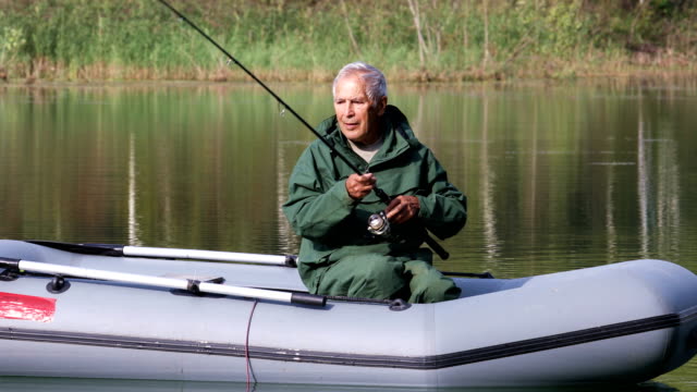 Older-man-fishing-in-a-boat