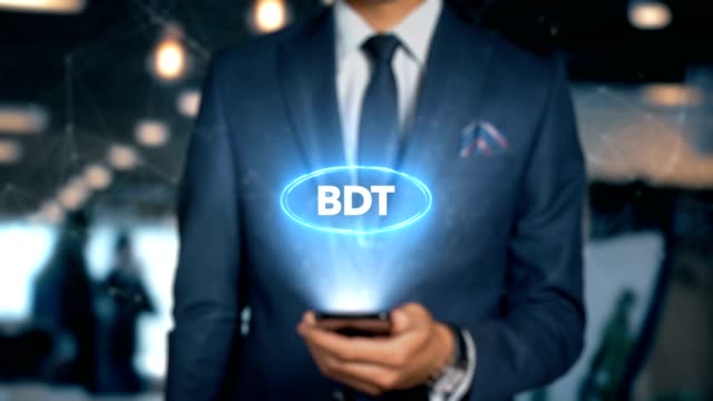 Businessman-With-Mobile-Phone-Opens-Hologram-HUD-Interface-and-Touches-Word---BDT