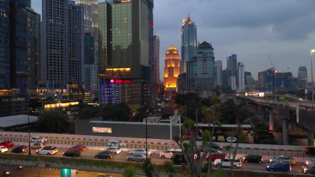 evening-illumination-kuala-lumpur-downtown-traffic-road-junction-aerial-panorama-4k-malaysia