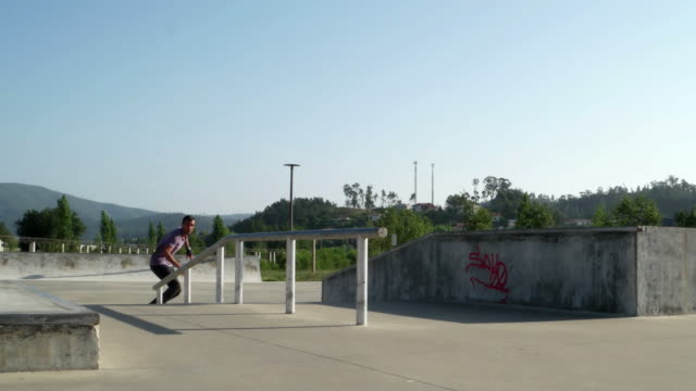 Skateboarder-performing-a-slide