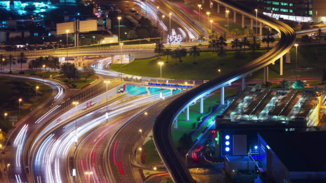 dubai-city-night-traffic-crossroad-roof-top-panorama-4k-time-lapse-united-arab-emirates