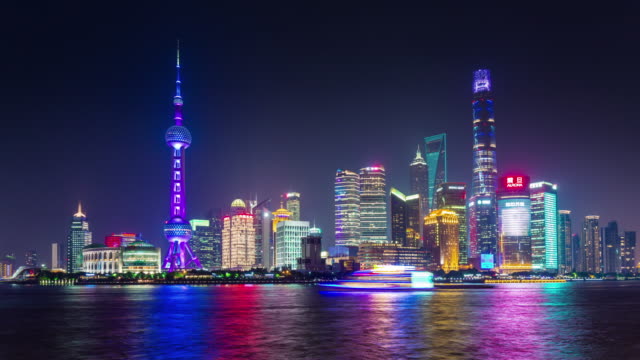 iluminación-nocturna-de-China-famoso-Shangai-panorama-ciudad-Bahía-4k-lapso-de-tiempo