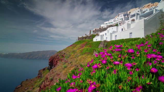 sunny-day-famous-santorini-island-town-hill-flowers-bay-panorama-4k-time-lapse-greece