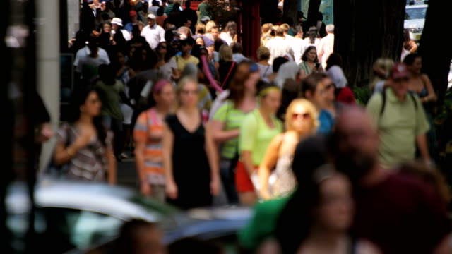 Multi-ethnic-people-walking-on-city-streets-America