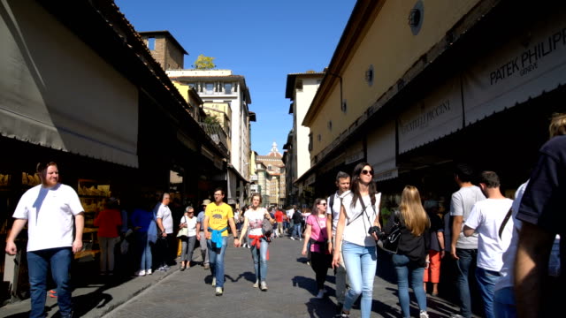 Walking-on-Ponte-Vecchio-Bridge-in-Florence,-Italy