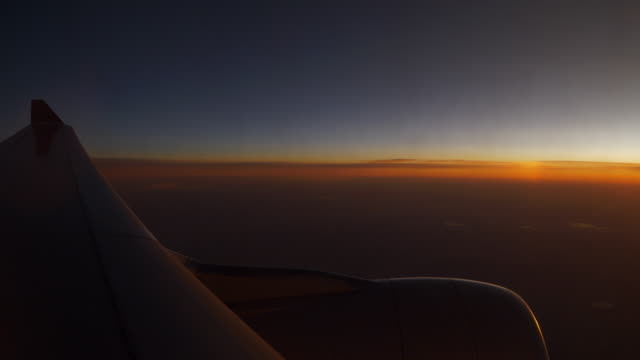 sunset-sun-light-airplane-window-seat-wing-view-4k-china