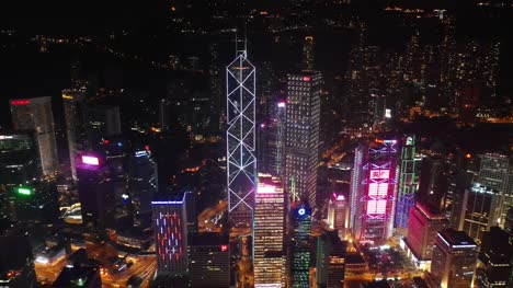 night-time-illuminated-hong-kong-city-downtown-traffic-bay-aerial-panorama-4k