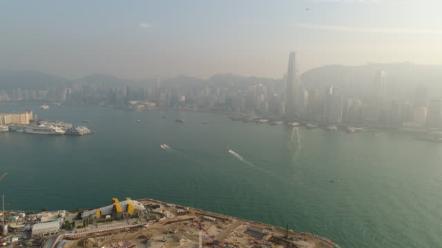 China-puesta-del-sol-famosa-hong-kong-Bahía-de-construcción-aérea-panorama-4k