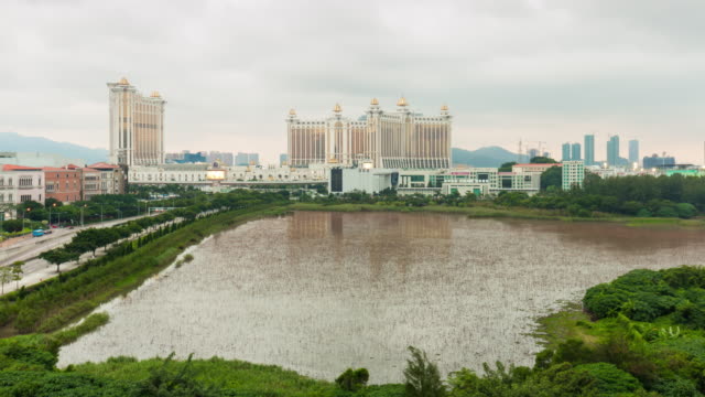 china-macau-day-light-famous-hotel-block-pond-panorama-4k-time-lapse