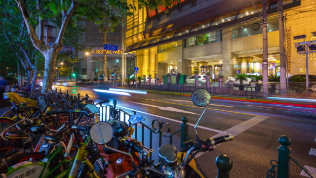 night-shanghai-city-traffic-street-bicycle-parking-panorama-4k-timelapse-china