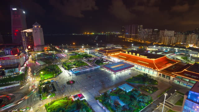 night-illuminated-zhuhai-city-gongbei-port-of-entry-crowded-square-rooftop-panorama-4k-time-lapse-china