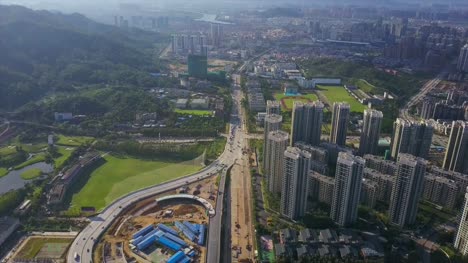 Zhuhai-ciudad-día-soleado-tráfico-carretera-construcción-panorama-aéreo-4k-china