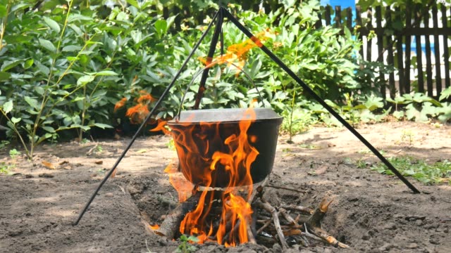 The-pot-of-water-hangs-over-the-fire.-The-water-boils.-Close-up
