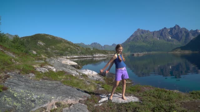 A-girl-is-dancing-against-a-nature-background