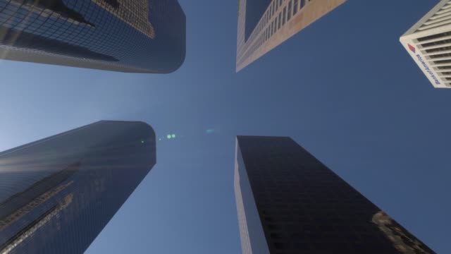 looking-up-moving-shot-of-modern-skyscrapers-in-downtown-Los-Angeles,-on-a-sunny-day-in-California