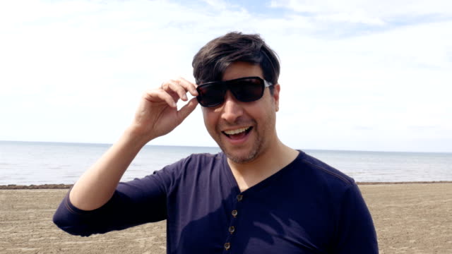 Man-Smiling-on-a-Beach