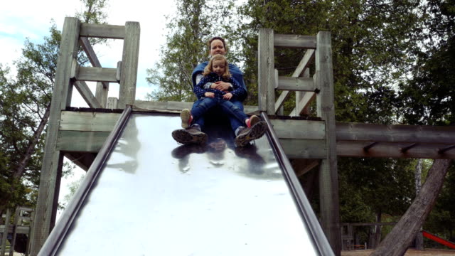 Mother-and-Little-Daughter-on-a-Slide