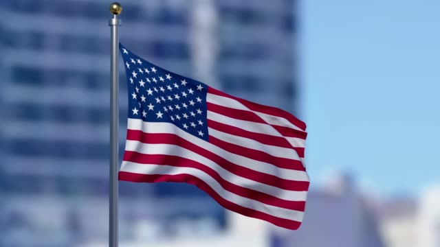 United-States-flag-in-the-city-with-buildings-behind