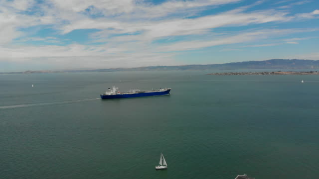 Drone-Shot-of-a-Commercial-Ship-Traveling-Across-the-Bay-in-San-Francisco,-California
