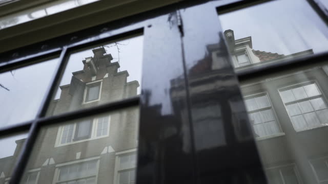 Dutch-Building-reflected-in-window.