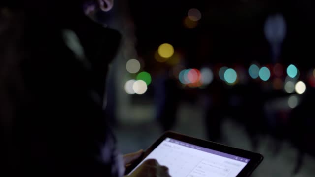 Handsome-man-teleworking-on-digital-tablet-at-night
