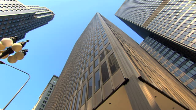 low-angle-HD-pan-of-multiple-skyscrapers