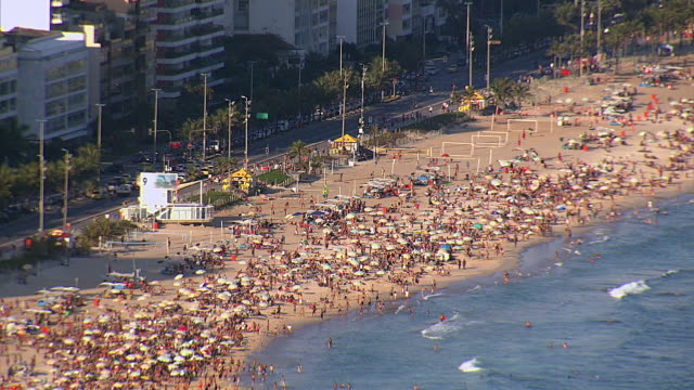 Aerail-view-of-crowded-Ipanema-Beach,-Rio-de-Janeiro,-Brazil