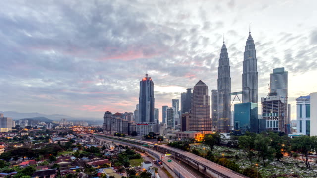 Majestic-sunrise-at-Kuala-Lumpur-city.-Moving-and-changing-color-clouds.-Aerial-view.