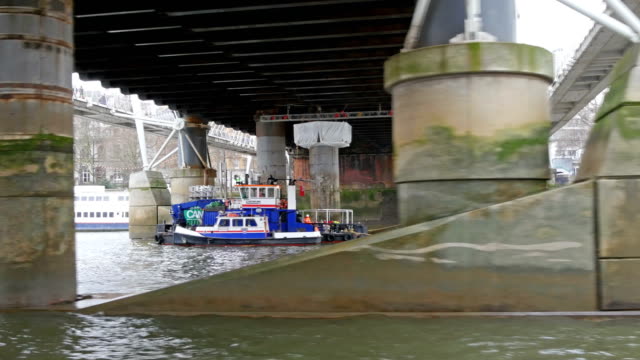 Big-blue-boat-docking-under-the-bridge