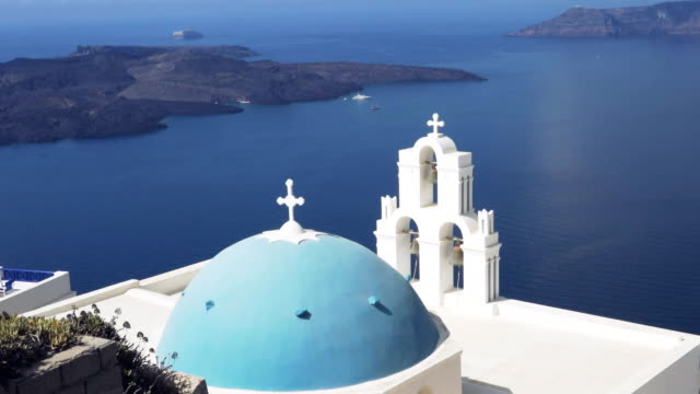 the-popular-three-bells-and-blue-dome-in-fira,-santorini