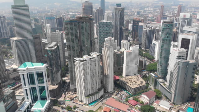 Aerial-footage-of-high-rise-buildings-in-Kuala-Lumpur,-Malaysia.-FullHD-Drone-video.