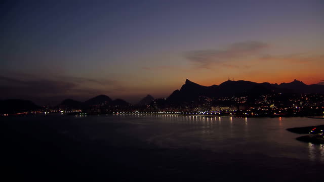 Low-angle-aerial-view-of-Rio-de-Janeiro-Bay-at-Dusk,-Brazil