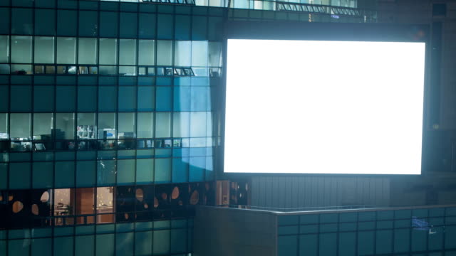 Timelapse-of-blinking-blank-screen-on-office-building-at-night.-Seoul,-South-Korea