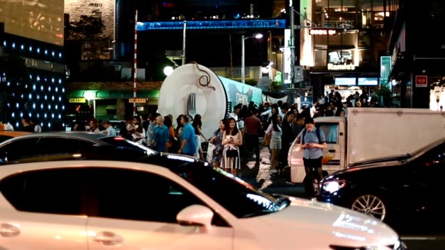 Still-shot-of-crowd-and-cars-at-Itaewon
