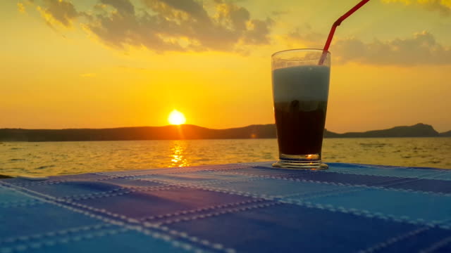 Iced-coffee-against-the-sunset.