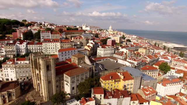 Aerial-view-of-historical-part-of-Lisbon-and-Lisbon-Cathedral-at-sunny-day-Portugal