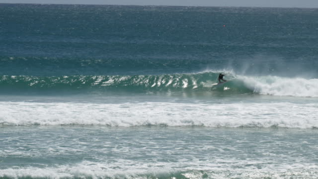 wide-view-of-a-kirra-surfer-on-their-backhand